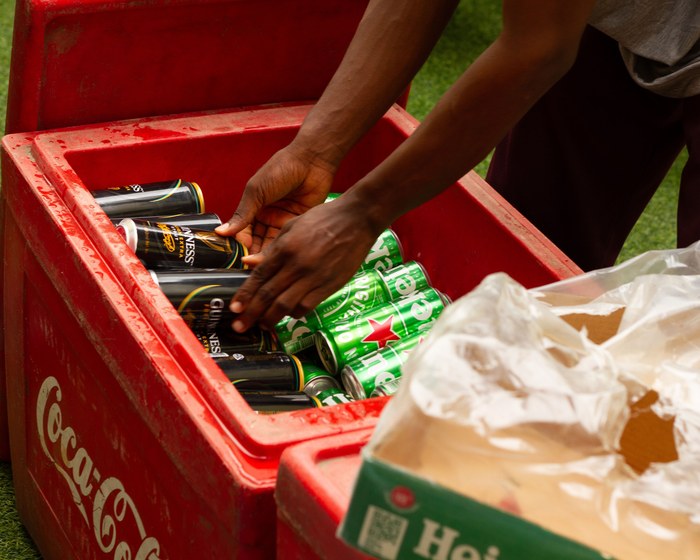 Staff organizing client supplied drinks into a cooler