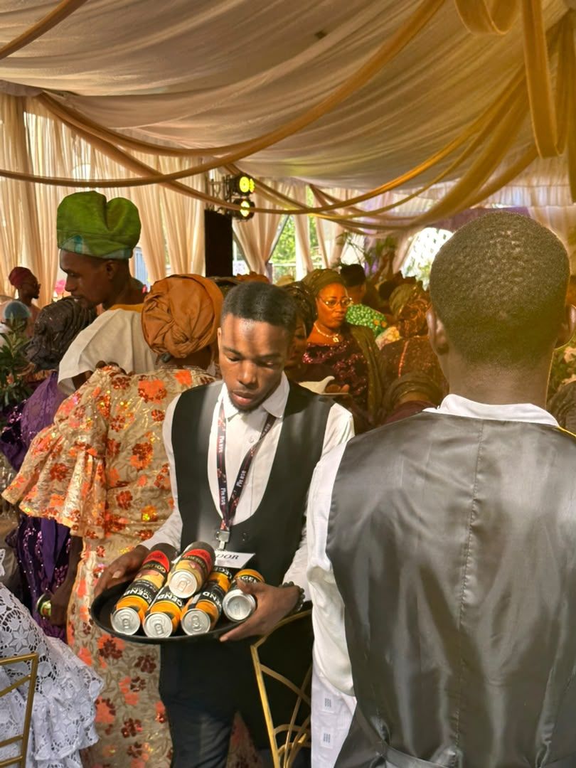 MANSA staff member holding a tray of drinks
