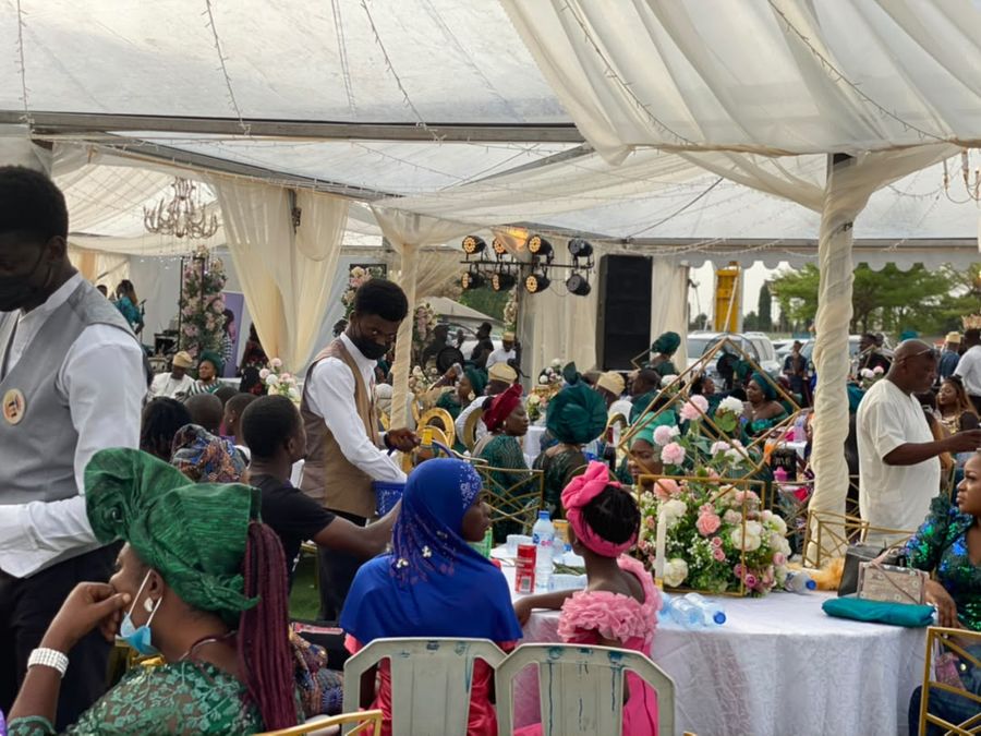 MANSA staff serving a seated guest